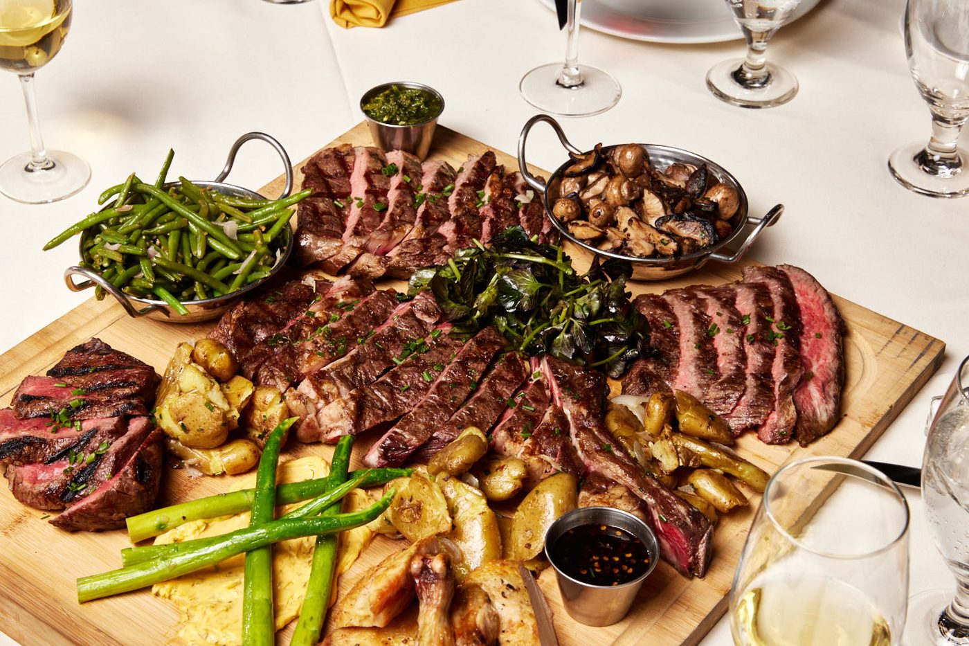 A platter of steaks and sides from Shallots Bistro
