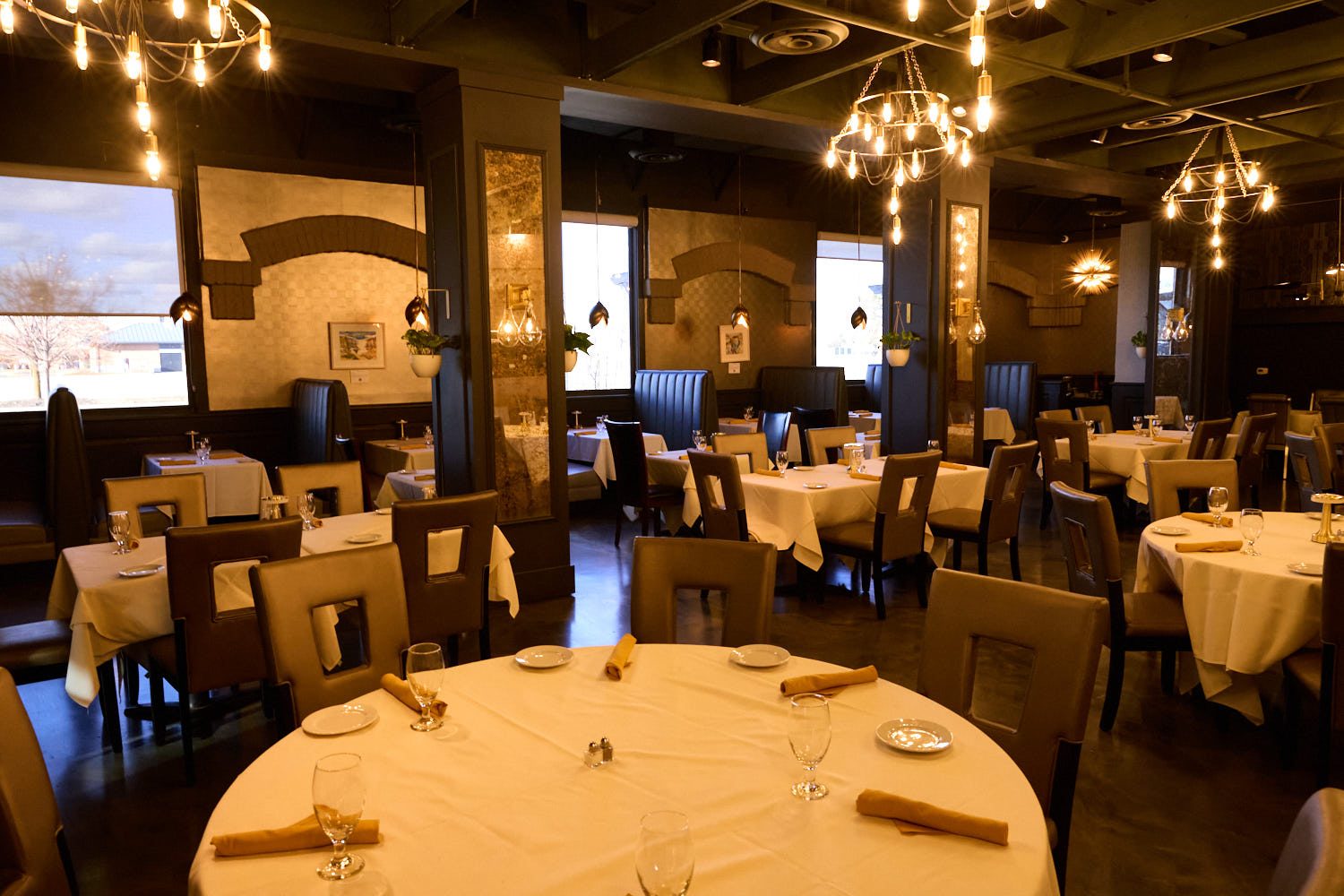The private dining room at Shallots Bistro under warm light